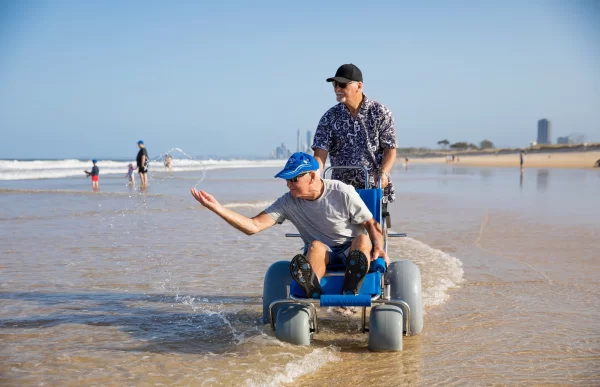 senior on a sandcruiser beach wheelchair