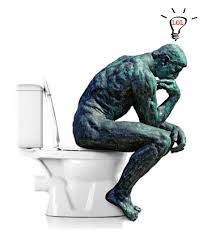 statue of man thinking on loo